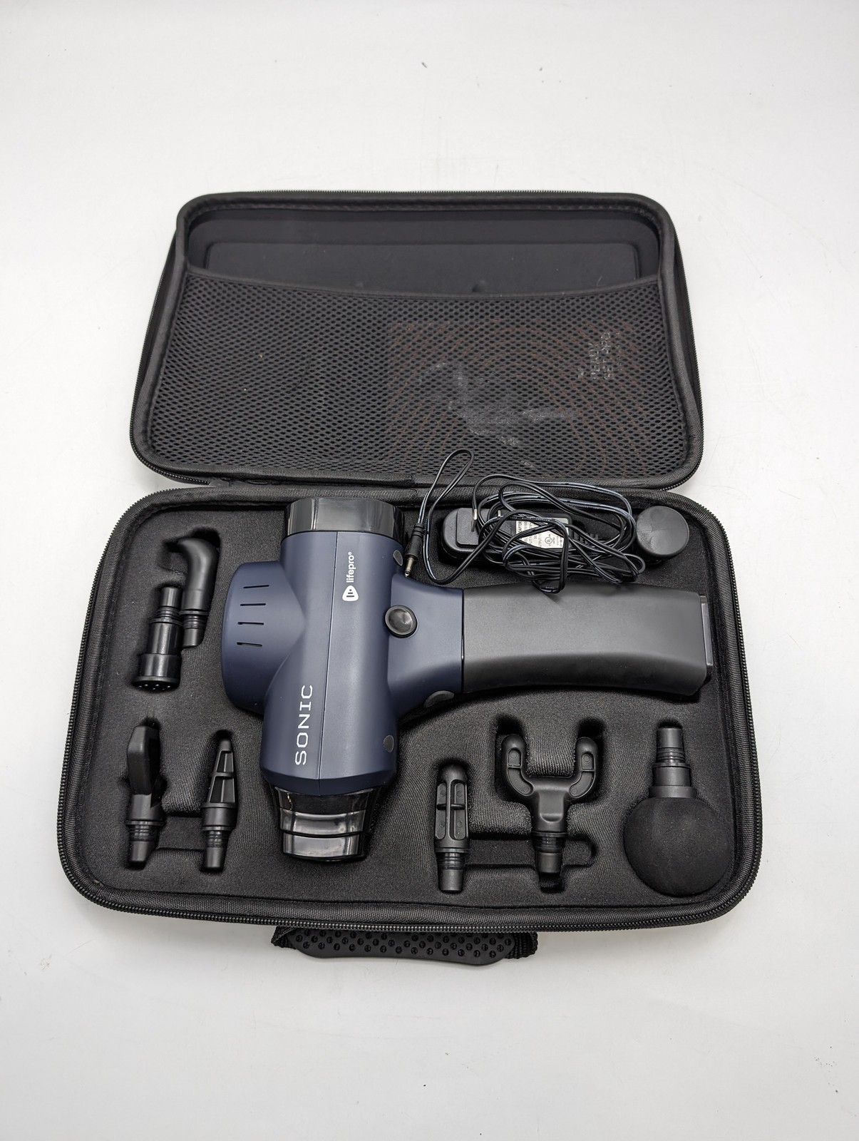 LIFEPRO LPSNC Sonic Handheld Percussion Massage Gun – 5 Speeds – 8 Heads – BLUE