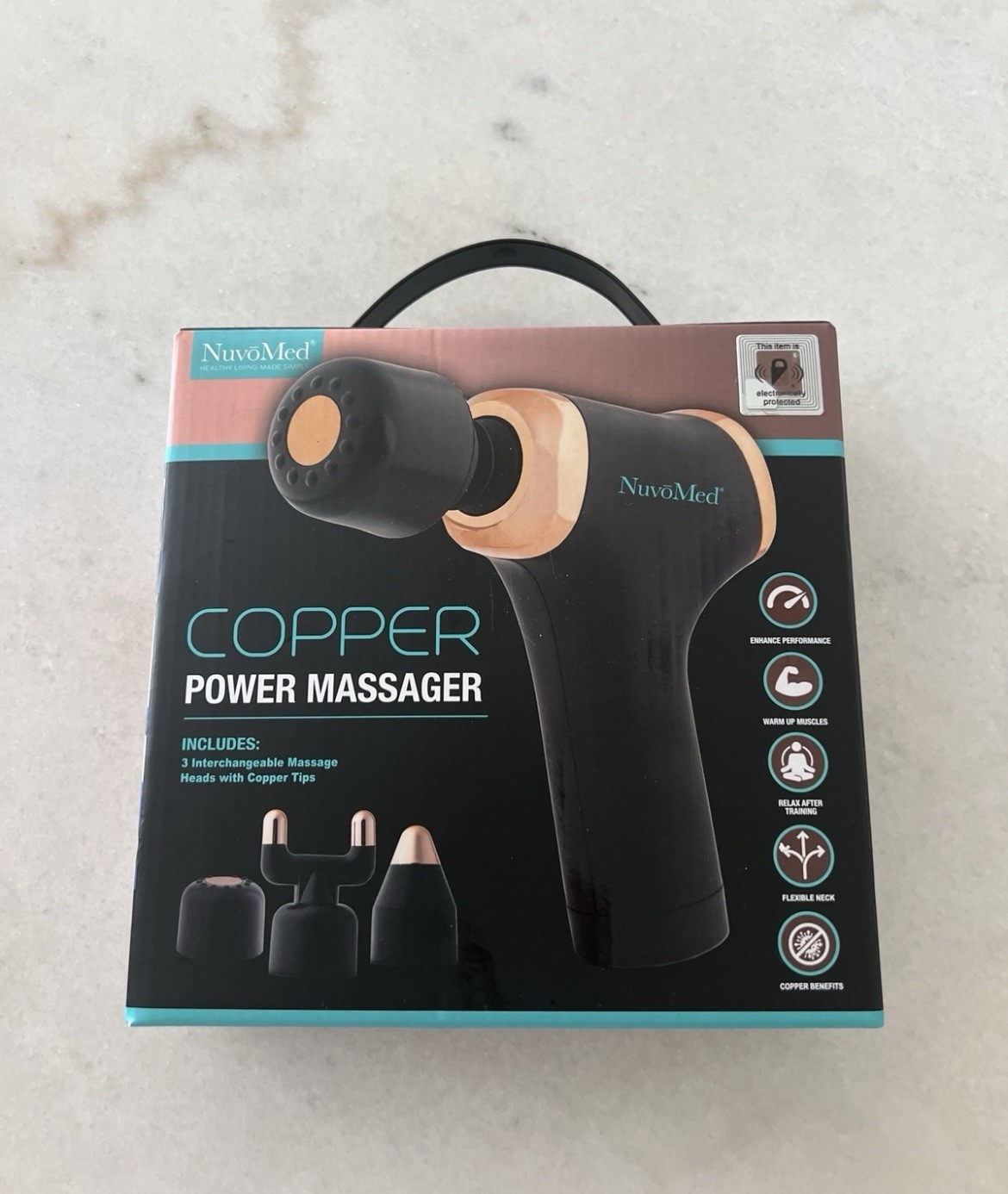 NuvoMed Copper Power Massager.The massager features three interchangeable heads
