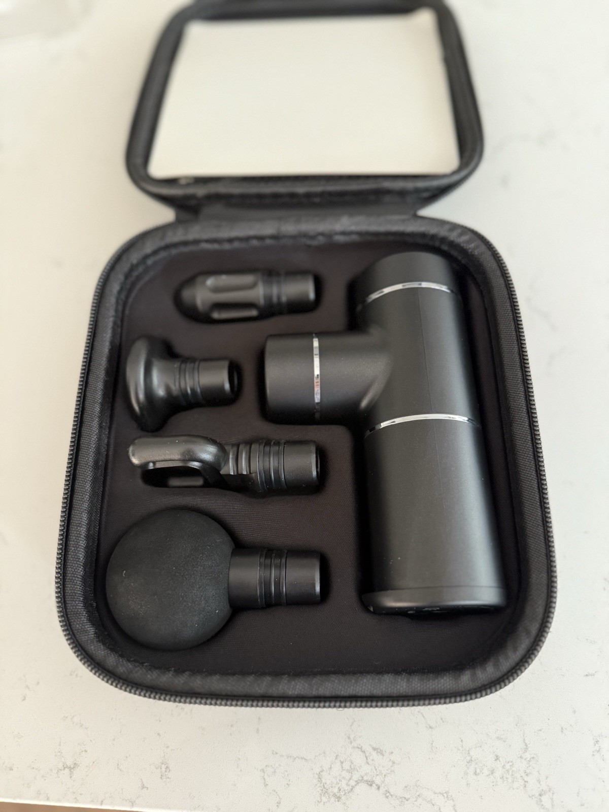 MASSAGE GUN WITH 4 ATTACHMENTS AND 3 SETTINGS IN A ZIP BAG BLACK – NEW