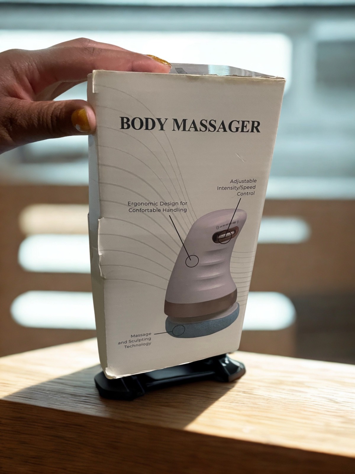 Hand held body massager