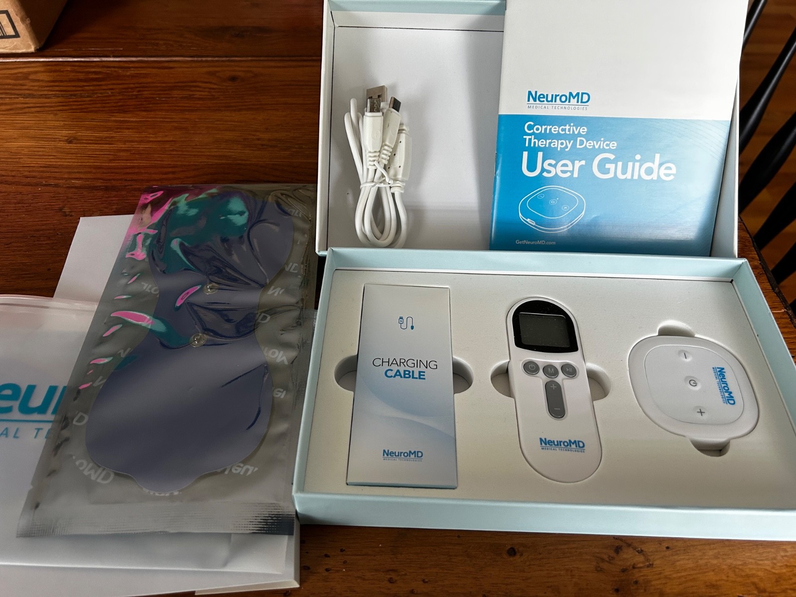 NeuroMD Back Pain Relief Corrective Therapy Device — NMES Technology